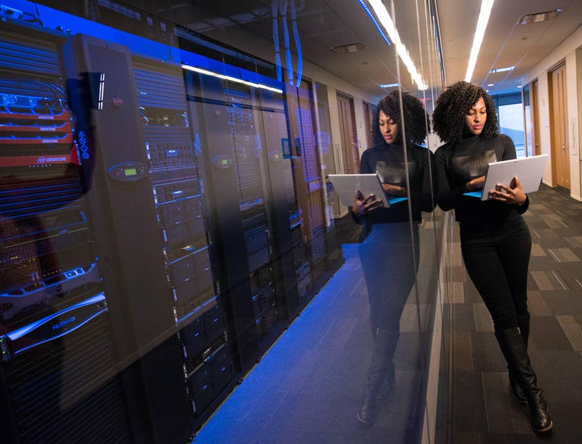 a web technician managing her client's web server system inside the server room
