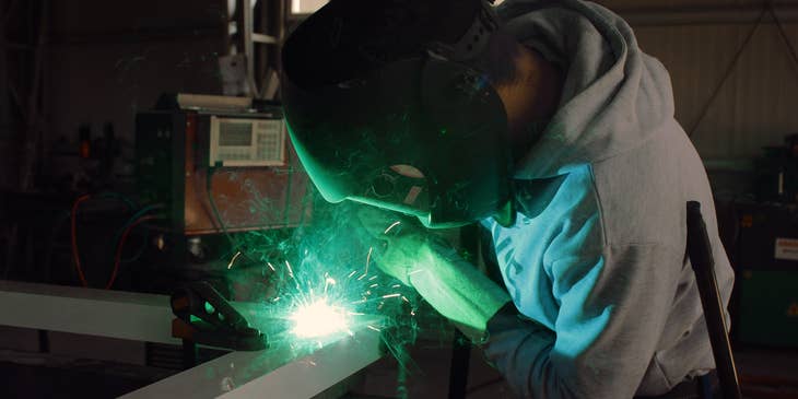 welder welding a steel frame