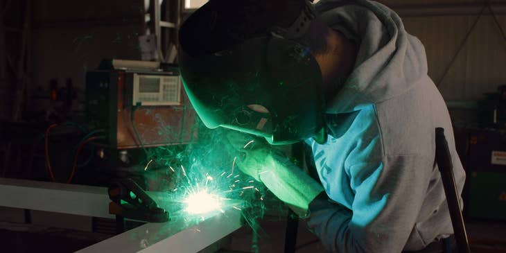 welder welding a steel frame