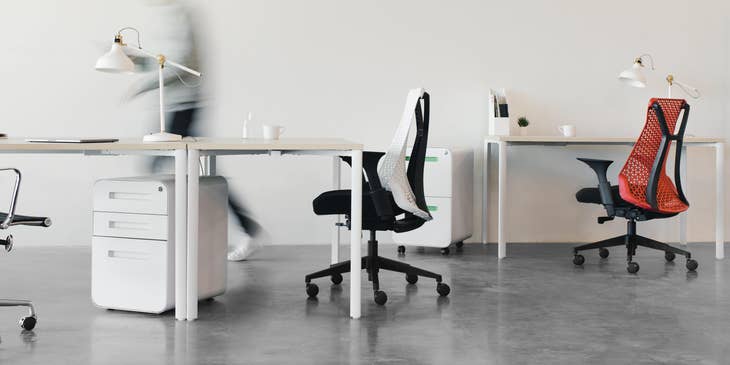 Person walking through empty office.