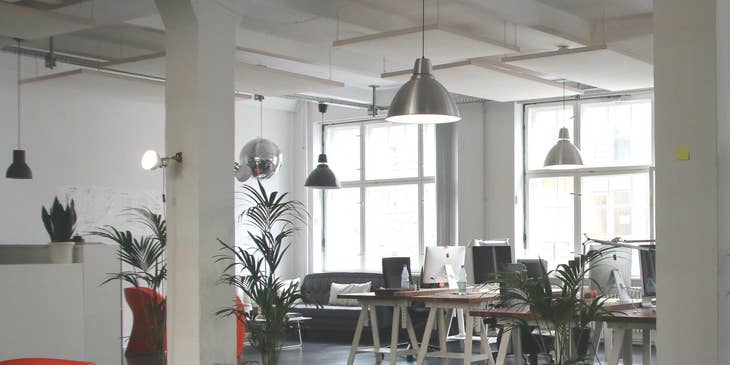 Empty desks in an office as an example of attrition in the workplace.