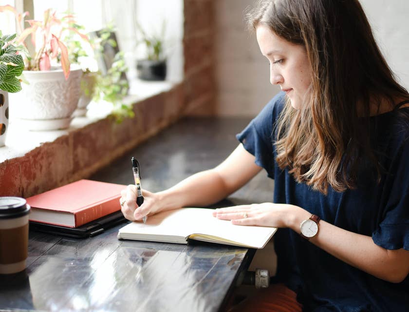 Writer in the middle of writing a short story for her weekly content