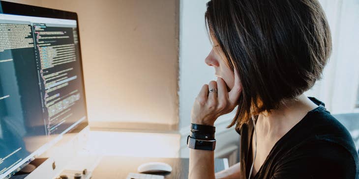 an XML developer debugging her current program before giving it to her client