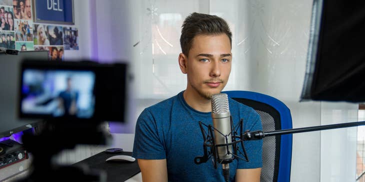 YouTuber recording himself along with his condenser microphone